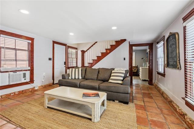 living room featuring cooling unit, stairway, recessed lighting, light tile patterned floors, and baseboards