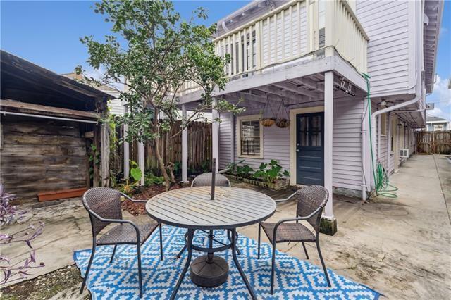 view of patio / terrace featuring a balcony and fence