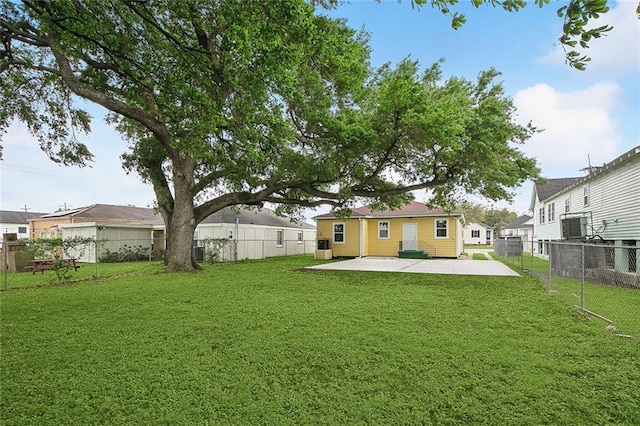 view of yard with a patio area, a residential view, and a fenced backyard