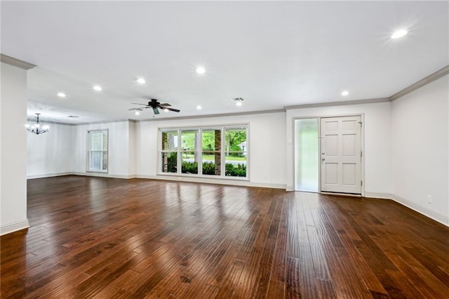 119 Belle Terre Blvd, Covington, LA 70433 - unfurnished living room featuring ceiling fan with notable chandelier, dark wood-style floors, baseboards, and crown molding