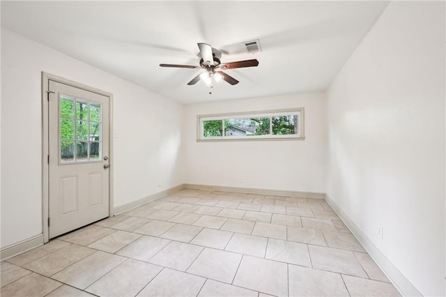 119 Belle Terre Blvd, Covington, LA 70433 - unfurnished room with baseboards, ceiling fan, a healthy amount of sunlight, and light tile patterned flooring