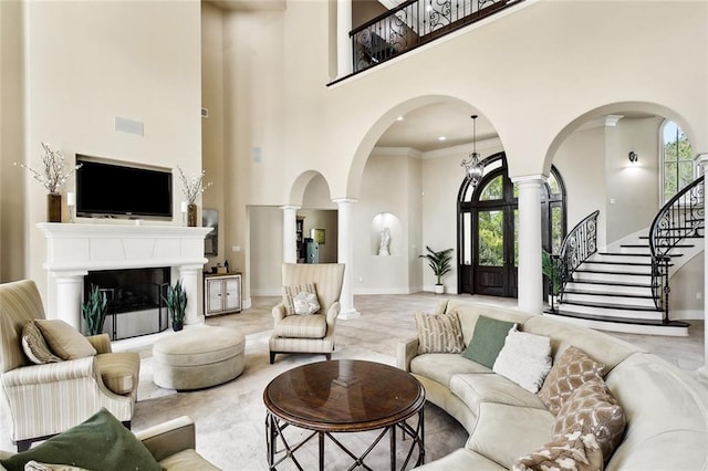 56 Preserve Ln, Mandeville, LA 70471 - living area featuring a wealth of natural light, arched walkways, and ornate columns
