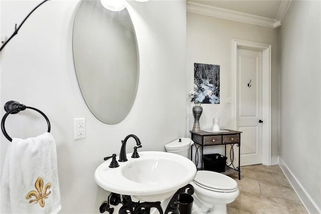 56 Preserve Ln, Mandeville, LA 70471 - half bathroom featuring toilet, a sink, crown molding, and baseboards