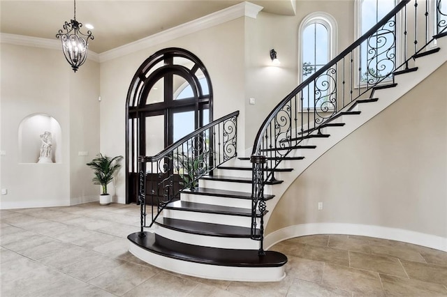 56 Preserve Ln, Mandeville, LA 70471 - foyer entrance with baseboards, ornamental molding, stairway, and a towering ceiling