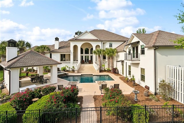 56 Preserve Ln, Mandeville, LA 70471 - rear view of property with a patio area, french doors, a gazebo, stucco siding, and fence private yard