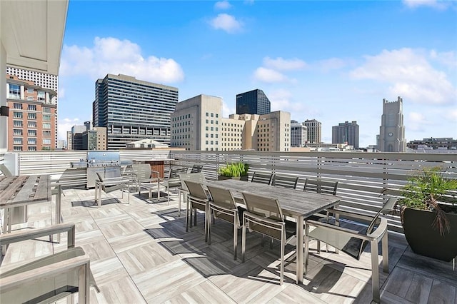 731 St Charles Ave Unit 311, New Orleans, LA 70130 - view of patio featuring a city view and outdoor dining space