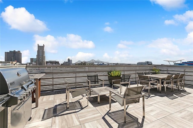 731 St Charles Ave Unit 311, New Orleans, LA 70130 - view of patio featuring grilling area and a city view