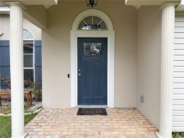 70281 7th St, Covington, LA 70433 - entrance to property featuring stucco siding and covered porch