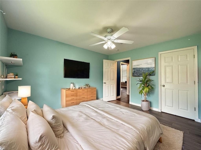 70281 7th St, Covington, LA 70433 - bedroom featuring baseboards, dark wood-style floors, and ceiling fan