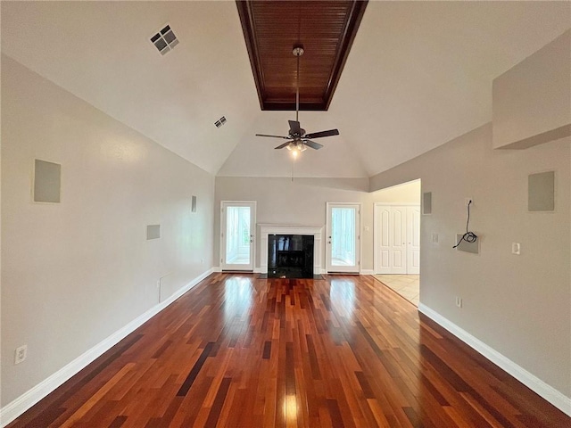 4026 Platt St, Kenner, LA 70065 - unfurnished living room with wood finished floors, a ceiling fan, vaulted ceiling, and a fireplace