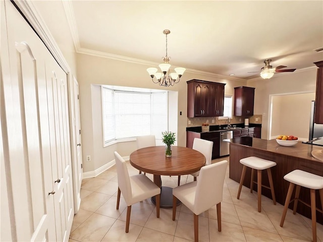 4026 Platt St, Kenner, LA 70065 - dining room with light tile patterned floors, a chandelier, crown molding, and a ceiling fan