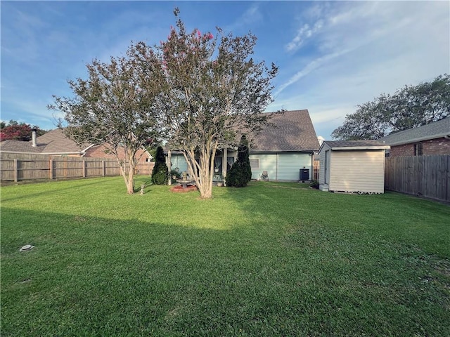 4026 Platt St, Kenner, LA 70065 - back of house with a fenced backyard and a storage unit