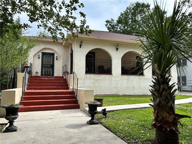 3612 Johnson St, Metairie, LA 70001 - view of front of property featuring stucco siding and a front lawn