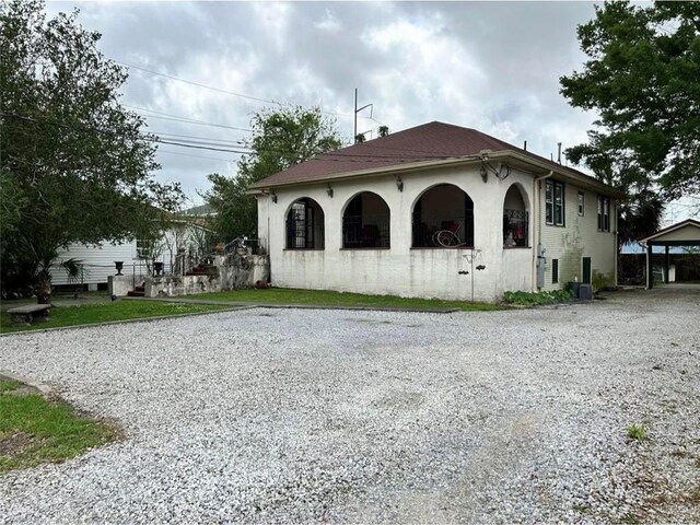 3612 Johnson St, Metairie, LA 70001 - view of property exterior with gravel driveway
