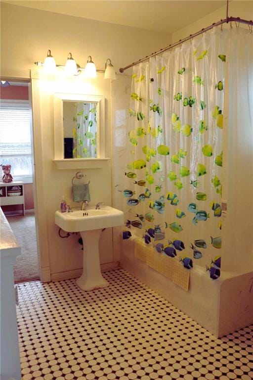 3612 Johnson St, Metairie, LA 70001 - full bathroom featuring shower / tub combo with curtain, tile patterned floors, and a sink