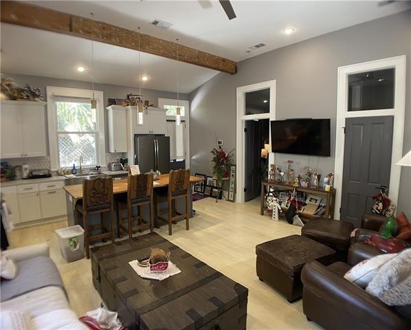 4413 S Liberty St Unit 4413, New Orleans, LA 70115 - living area with a ceiling fan, visible vents, beam ceiling, light wood finished floors, and recessed lighting