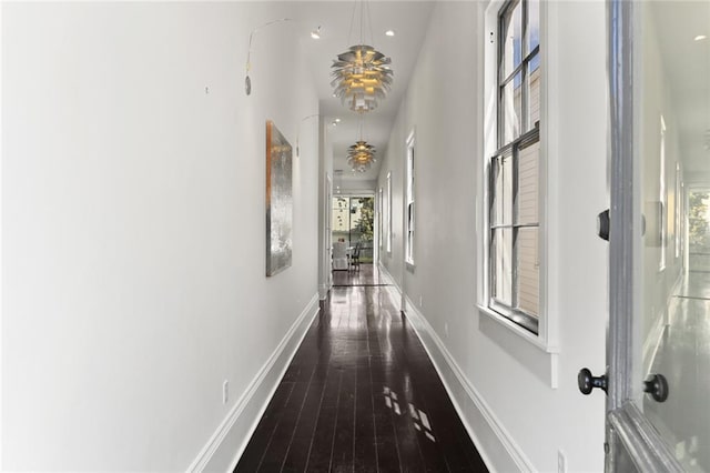 1035 Arabella St, New Orleans, LA 70115 - hallway featuring plenty of natural light, hardwood / wood-style flooring, baseboards, and recessed lighting