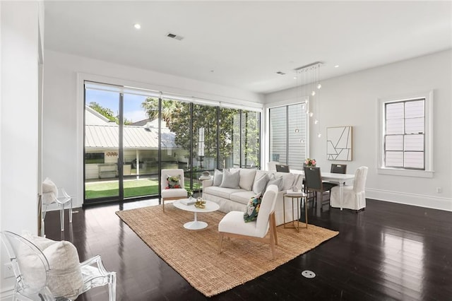 1035 Arabella St, New Orleans, LA 70115 - living room featuring wood finished floors, recessed lighting, and baseboards