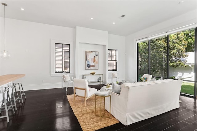 1035 Arabella St, New Orleans, LA 70115 - living room with dark wood-type flooring, healthy amount of natural light, baseboards, and recessed lighting