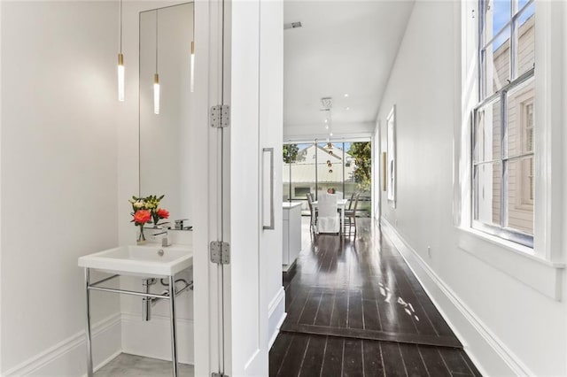 1035 Arabella St, New Orleans, LA 70115 - corridor with dark wood-type flooring and baseboards