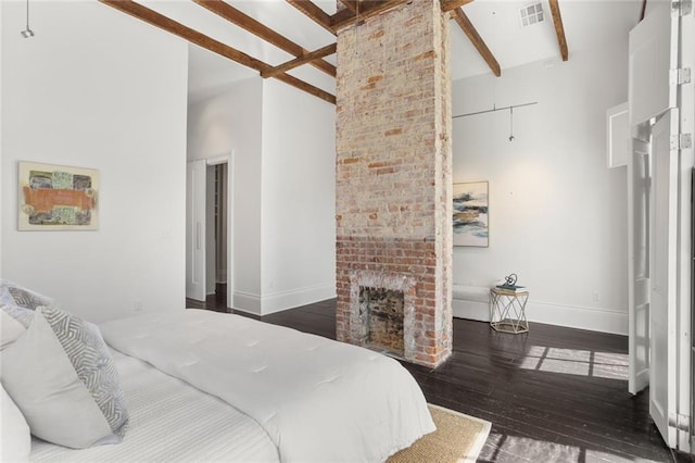1035 Arabella St, New Orleans, LA 70115 - bedroom with hardwood / wood-style flooring, baseboards, high vaulted ceiling, a brick fireplace, and beamed ceiling
