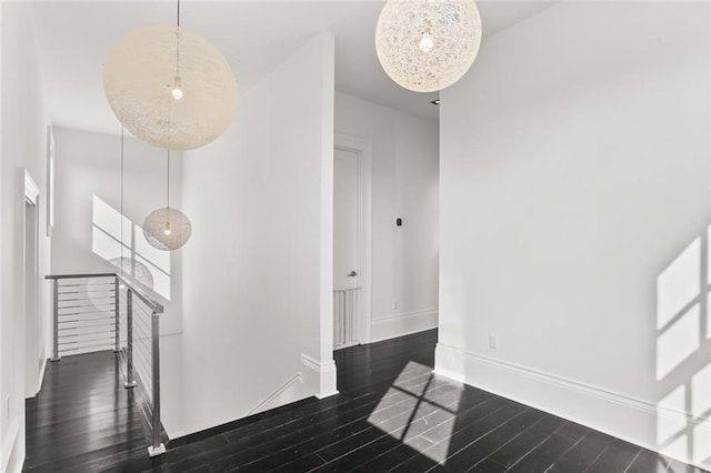 1035 Arabella St, New Orleans, LA 70115 - corridor with an upstairs landing, wood finished floors, and baseboards