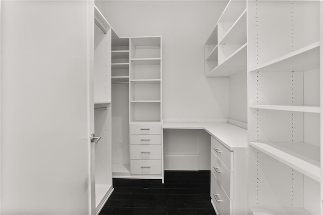 1035 Arabella St, New Orleans, LA 70115 - spacious closet featuring dark wood-style flooring