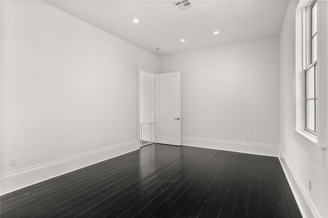 1035 Arabella St, New Orleans, LA 70115 - unfurnished room with dark wood-style floors, baseboards, and recessed lighting