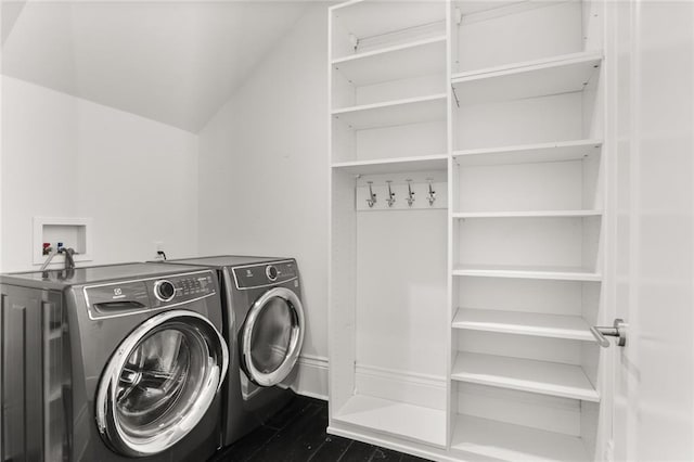 1035 Arabella St, New Orleans, LA 70115 - laundry room with washer and clothes dryer and dark wood-type flooring