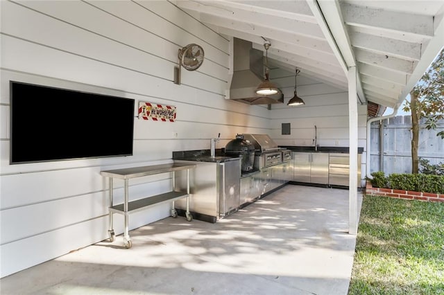 1035 Arabella St, New Orleans, LA 70115 - view of patio / terrace featuring exterior kitchen, a grill, a sink, and fence