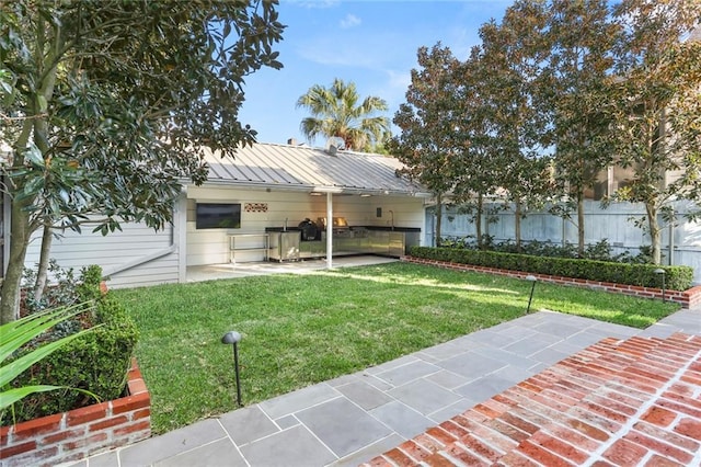 1035 Arabella St, New Orleans, LA 70115 - view of front facade with a patio area, metal roof, and a standing seam roof