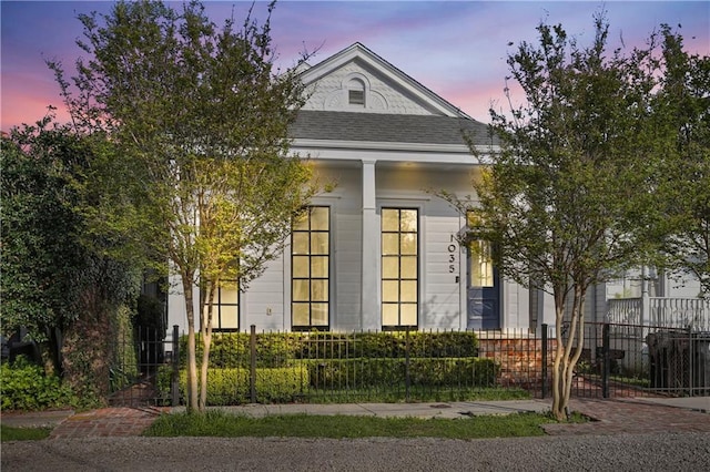 1035 Arabella St, New Orleans, LA 70115 - view of front of home featuring a fenced front yard and a shingled roof