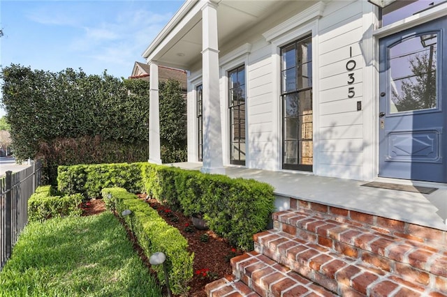 1035 Arabella St, New Orleans, LA 70115 - view of property exterior featuring covered porch and fence