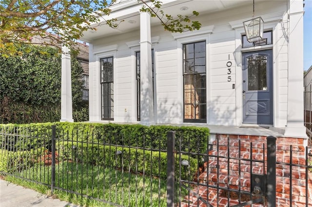 1035 Arabella St, New Orleans, LA 70115 - view of property exterior featuring covered porch and fence