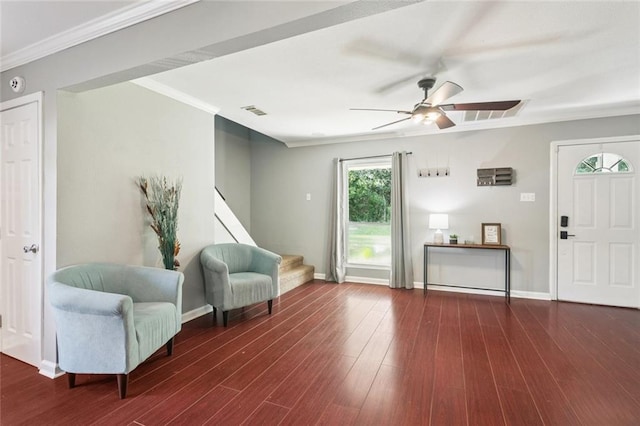 2106 Swan St, Slidell, LA 70460 - sitting room with stairway, crown molding, a ceiling fan, wood finished floors, and baseboards