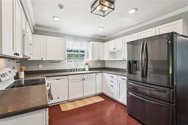 2106 Swan St, Slidell, LA 70460 - kitchen featuring white appliances, a sink, crown molding, dark countertops, and white cabinetry