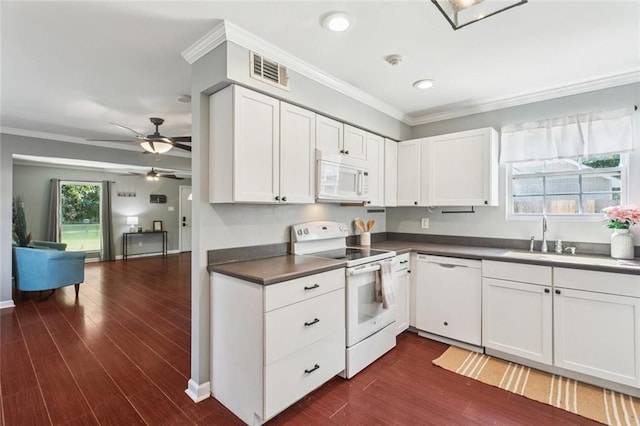 2106 Swan St, Slidell, LA 70460 - kitchen featuring white appliances, crown molding, a sink, white cabinets, and ceiling fan