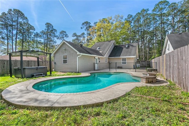 2106 Swan St, Slidell, LA 70460 - view of swimming pool with a hot tub, a fenced backyard, and a patio
