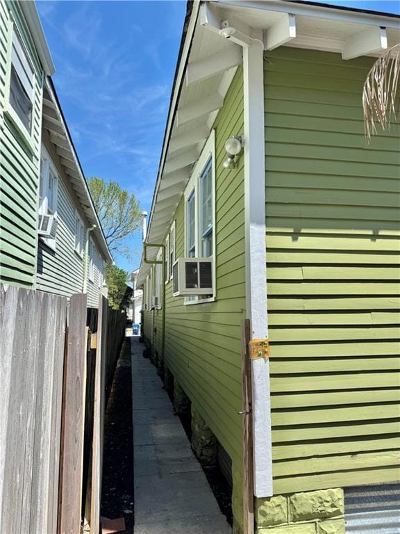 770002 Spruce St, New Orleans, LA 70118 - view of home's exterior with fence and cooling unit