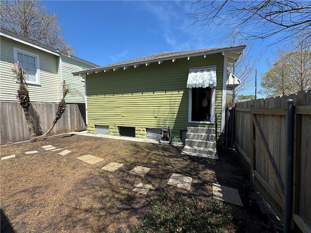 770002 Spruce St, New Orleans, LA 70118 - back of property with a fenced backyard and entry steps
