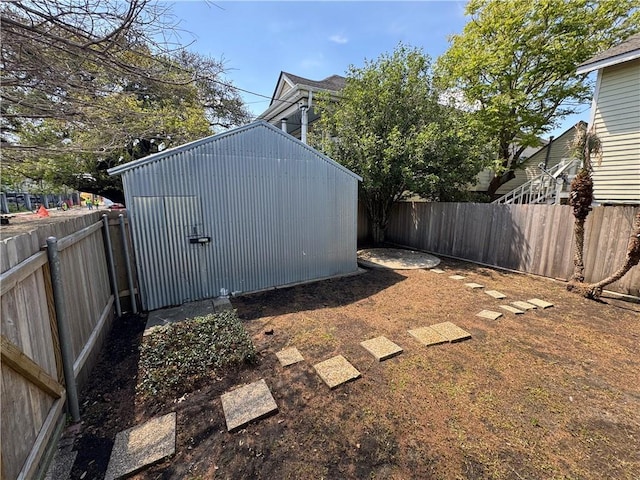 770002 Spruce St, New Orleans, LA 70118 - view of yard with a fenced backyard, an outdoor structure, and a storage shed