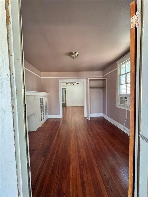 770002 Spruce St, New Orleans, LA 70118 - interior space with dark wood finished floors, baseboards, and ceiling fan