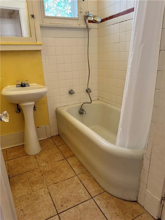 770002 Spruce St, New Orleans, LA 70118 - full bath with a shower with curtain, baseboards, and a bath