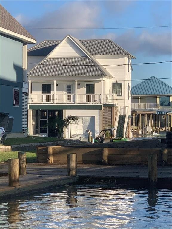 view of front of home featuring a boat dock