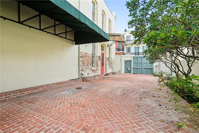 515 Ursulines Ave, New Orleans, LA 70116 - view of patio with a gate and fence