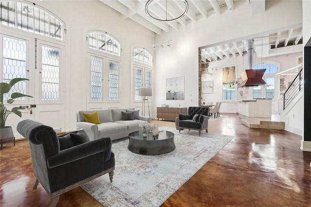 515 Ursulines Ave, New Orleans, LA 70116 - living room featuring a towering ceiling, beamed ceiling, and finished concrete floors