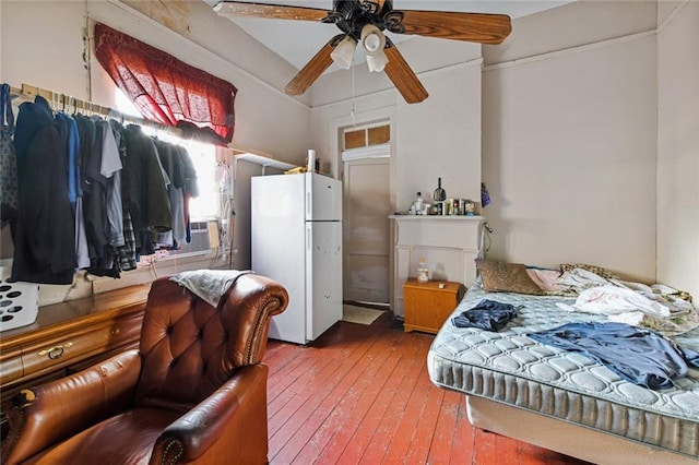 427 Manasses Pl, New Orleans, LA 70119 - bedroom with ceiling fan, freestanding refrigerator, and hardwood / wood-style flooring