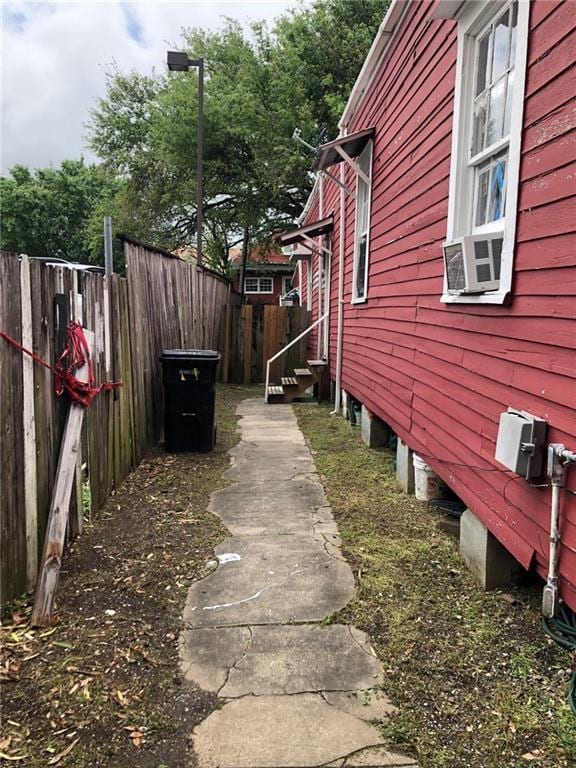 427 Manasses Pl, New Orleans, LA 70119 - view of side of home featuring fence and cooling unit
