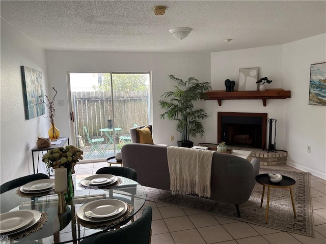 2626 Lepage St, New Orleans, LA 70119 - living area with tile patterned floors, a brick fireplace, and a textured ceiling