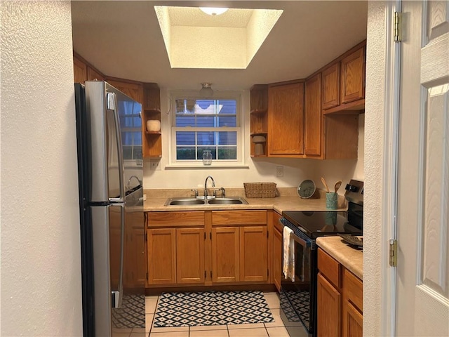 2626 Lepage St, New Orleans, LA 70119 - kitchen with black electric range oven, open shelves, a sink, light tile patterned floors, and freestanding refrigerator